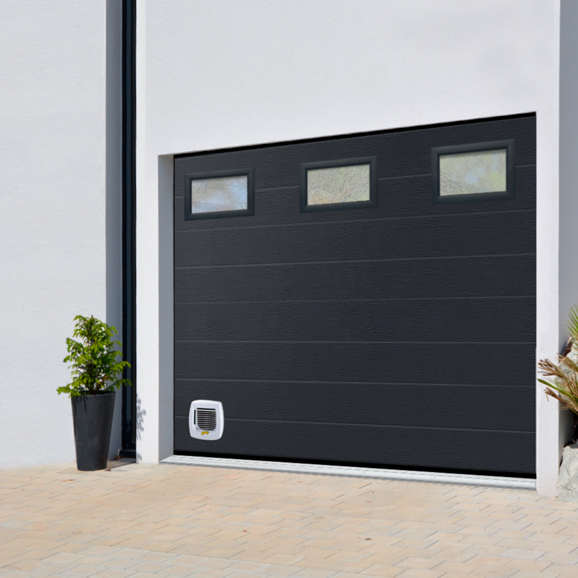 Porte de garage sectionnelle avec hublots Confort+ - MAE